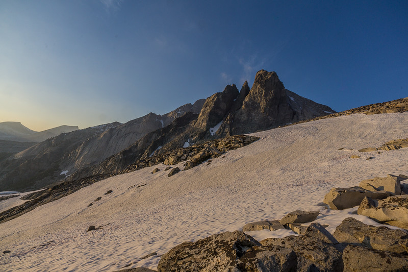 Jagged granite crags above the evening snowfield at Kaweah Gap