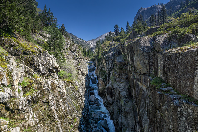 Hamilton Creek rushing through a narrow granite ravine below the bridge