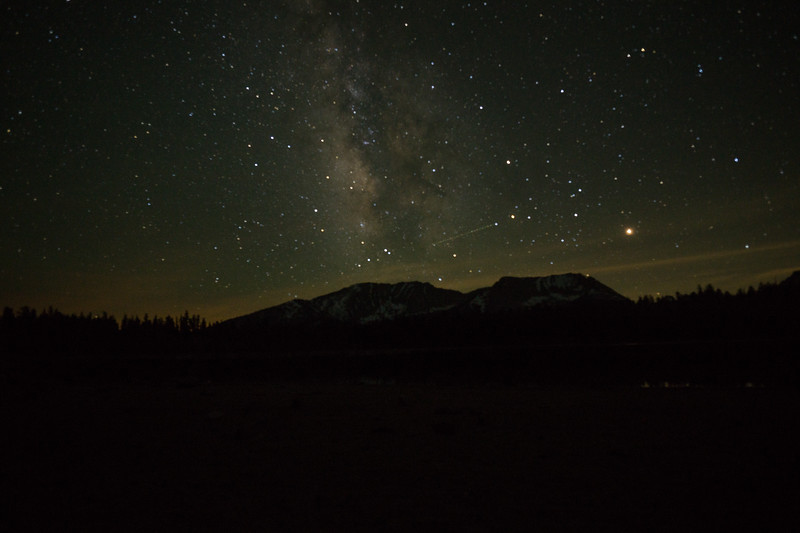 Milky Way above the mountains and dark shore of Moraine Lake