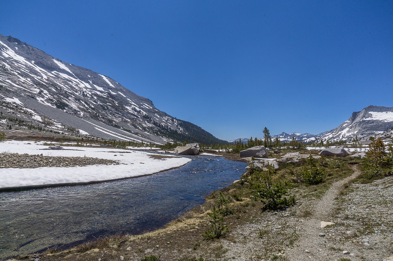 High Sierra Trail following the widening Big Arroyo stream toward the forest