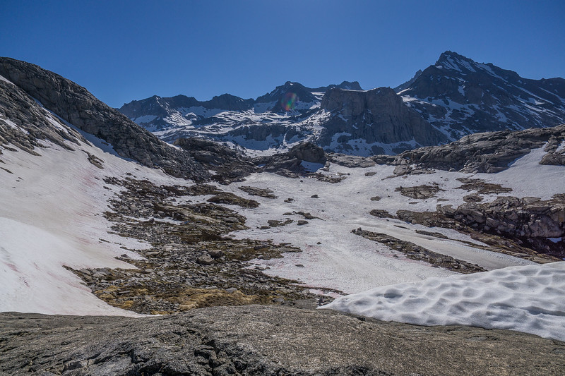 Steep icy chutes descending from the rocky finger above Precipice Lake