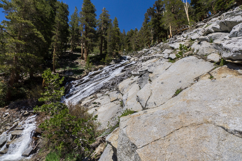 Mountain stream cascading over granite on the climb above Arroyo Junction