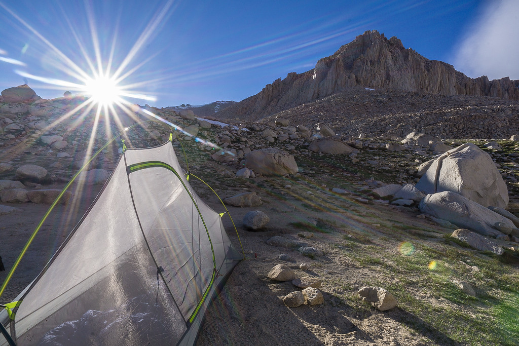 Tent at Guitar Lake with evening sun over the Mount Whitney basin