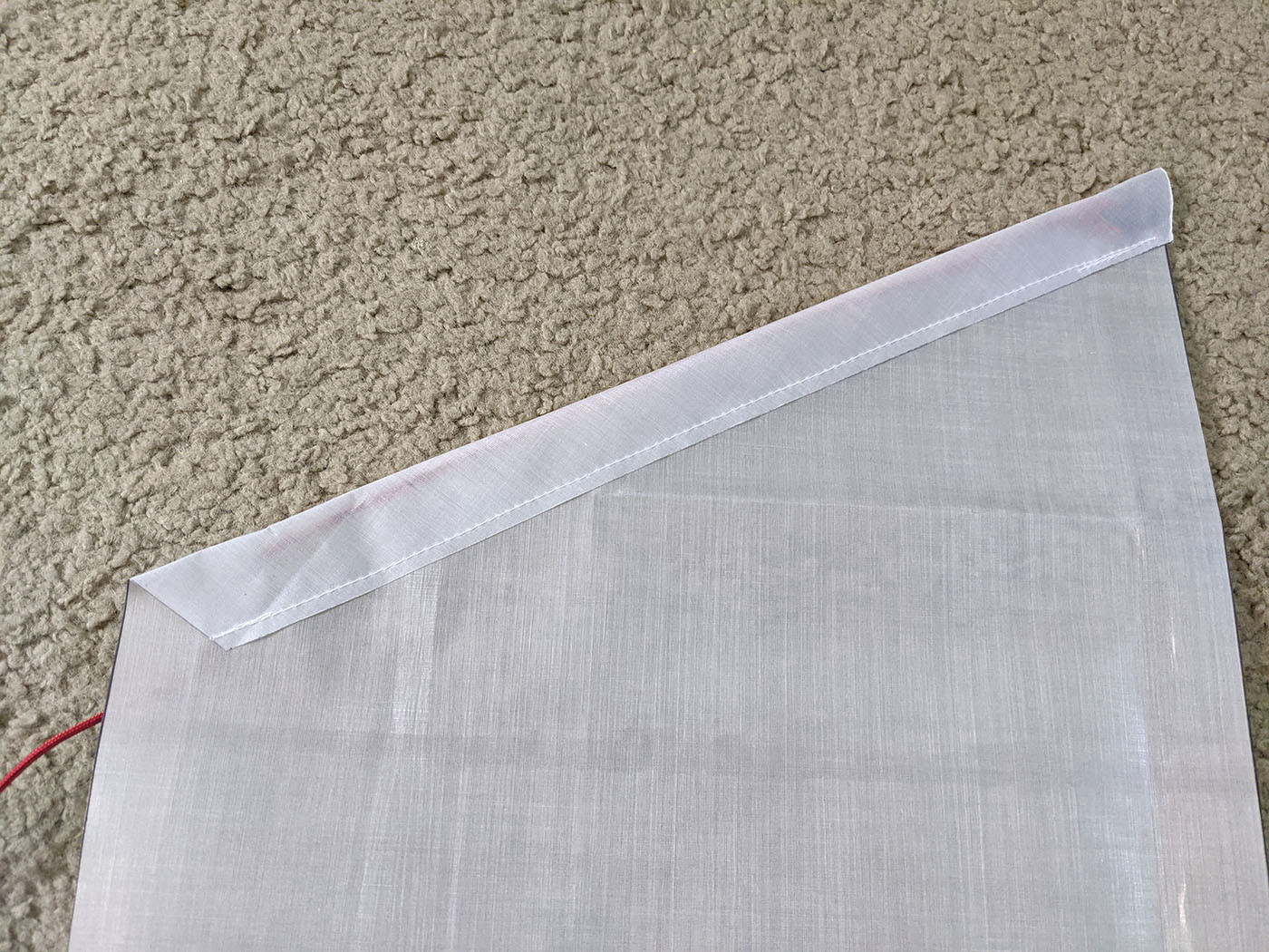 side-pocket-back.jpg Hemmed angled top edge of a white Dyneema side pocket