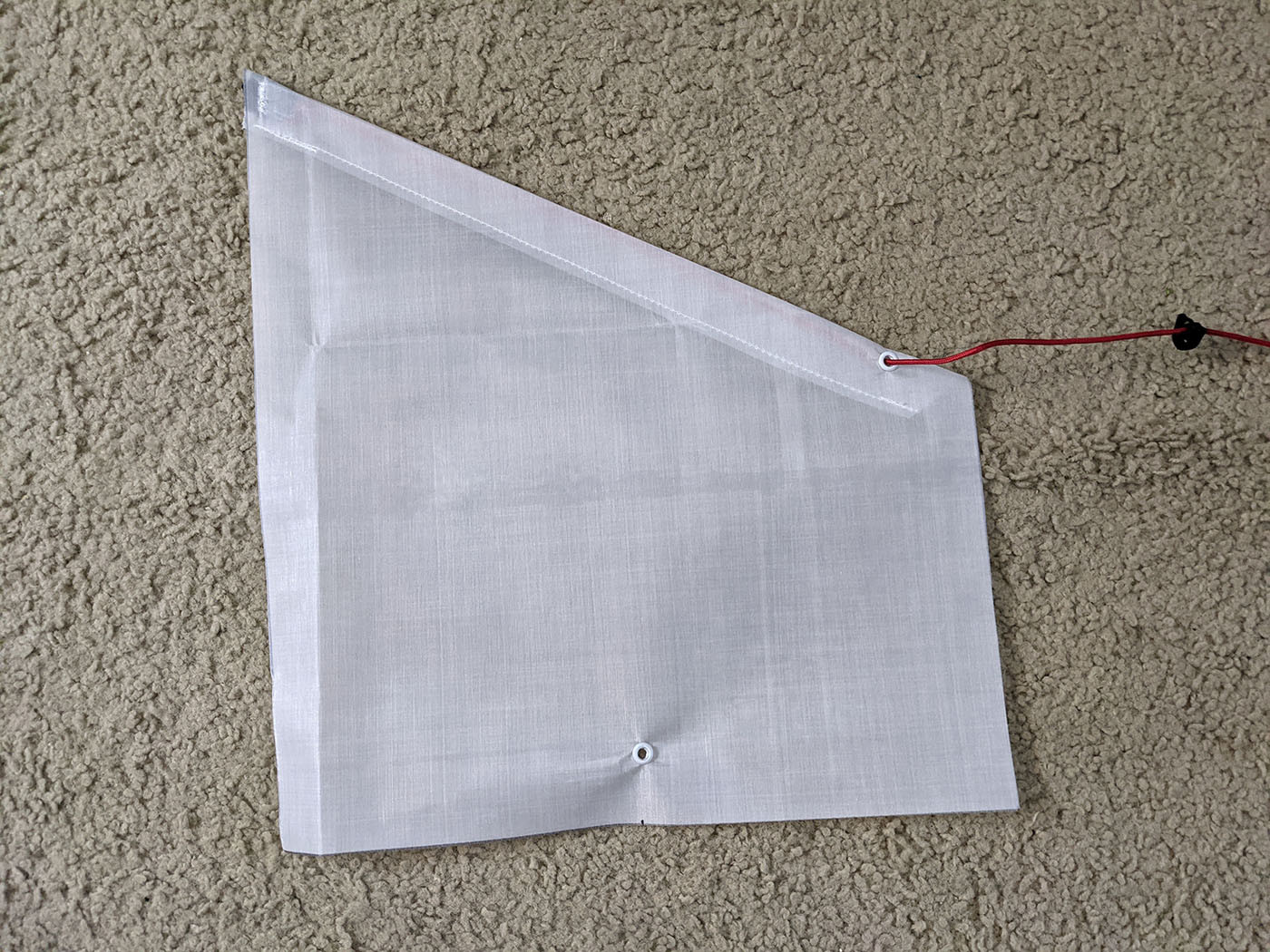 side-pocket-front.jpg Finished Dyneema side pocket with grommets and red shock cord