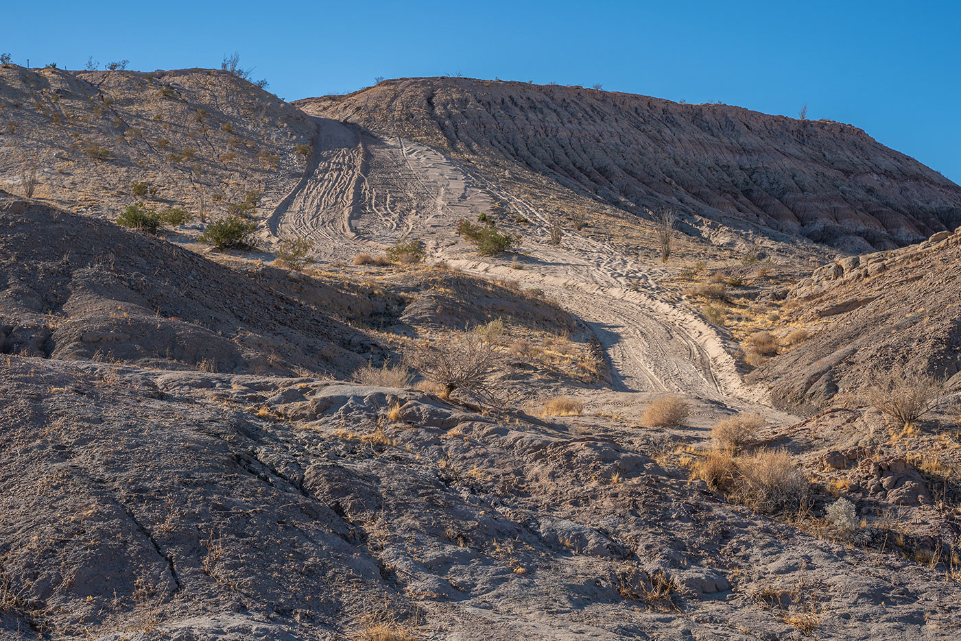 the-drop-off-anza-borrego.jpg Steep sandy off-road hill called The Drop Off with many tire tracks