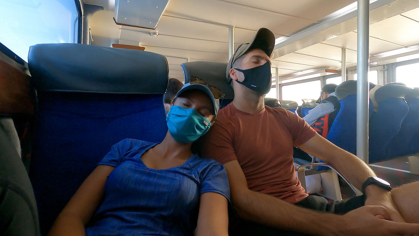 catalina-island-ferry-napping.jpg Two masked kayakers napping together on the Catalina ferry