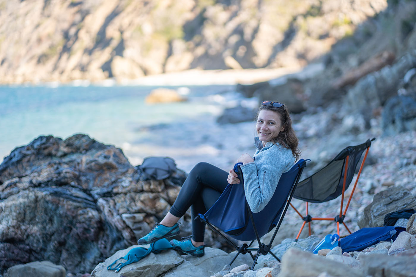 private-beach-catallina-island.jpg Camper relaxing in a chair on the secluded Italian Gardens beach