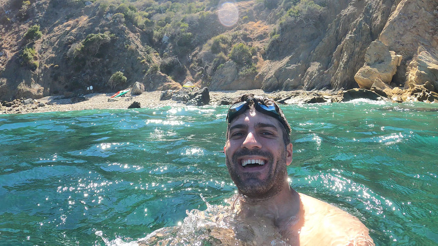 swimming-catalina-island.jpg Swimmer smiling in the turquoise water below the Italian Gardens campsite